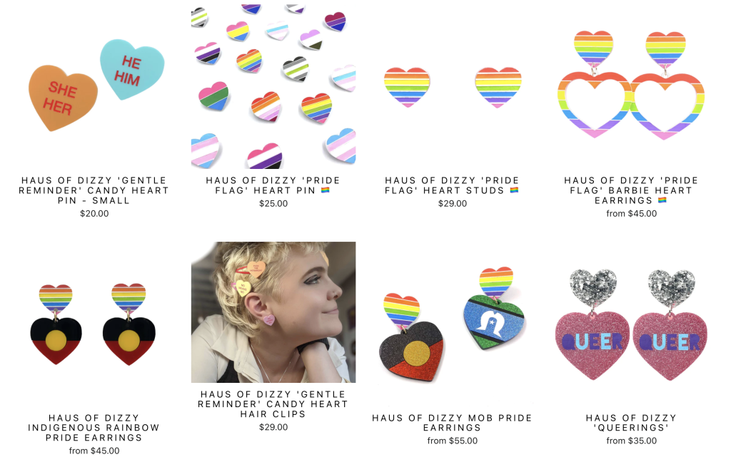 Screenshot from Haus of Dizzy website featuring products from their LGBTQIA+ Collection, including pronoun pins, pride flag heart pins, and assorted pride earrings.